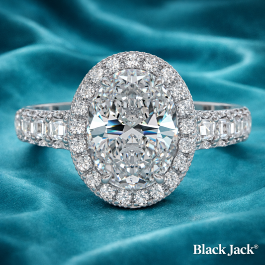 Diamond ring with 'Black Jack' branding on a blue fabric background